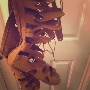 Laced up knee high sandal